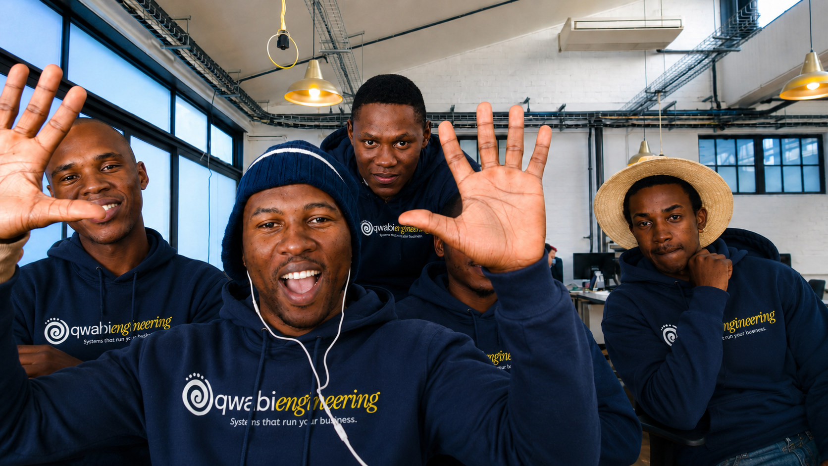 Qwabi Engineering team in branded hoodies at the Queenstown studio
